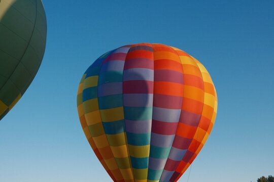 Colorful hot air balloon against a clear blue sky