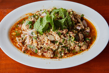 Close-up view of spicy minced fish salad in plate