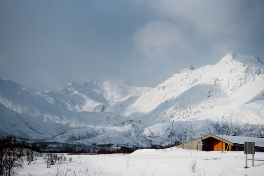 Snowy Mountain Landscape with Cabin