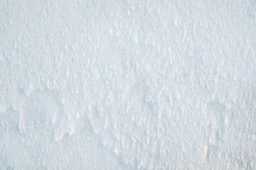 Snow texture abstract background top view. Winter snowy ice surface in cold weather outdoors. Natural white frozen pattern for Christmas, weather and climate design.