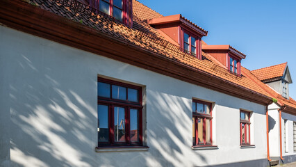 Terracotta roofing tiles on a traditional building, showcasing energy-efficient design and durable construction elements, enhancing architectural aesthetics and sustainability