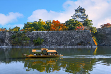Osaka Gozabune boat ride with tourists at the inner moat of Osaka castle in Osaka, japan