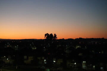 
sunset in the city with orange colors in the sky