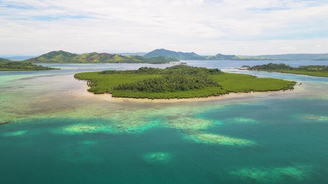 Scenic Cinematic aerial drone video of Siargao island with East Bucas Island and Bancuyo Island, Dapa, Surigao den Norte, Mindanao, Philippines