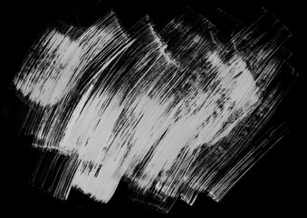Abstract grunge paint brush strokes background. Black and white distressed backdrop. Suitable for artistic overlay. 