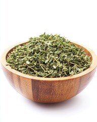 A wooden bowl filled with fragrant dried oregano leaves, showcasing their vibrant green color and texture.