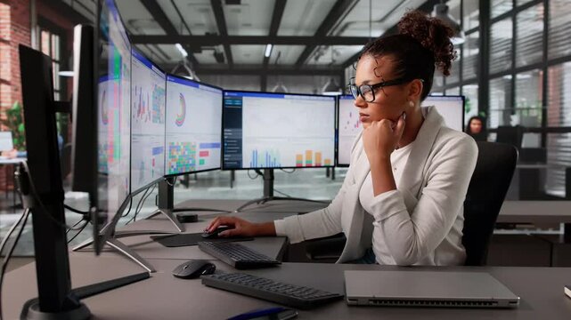 Woman Looking Overwhelmed At Business Data