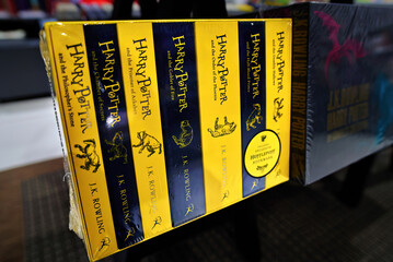 Naklejka premium Minsk, Belarus. Jan 12, 2025. Collection of Harry Potter novels in english language written by J.K. Rowling displayed on bookstore shelf, fantasy literature series popular with readers, fans. Selectiv