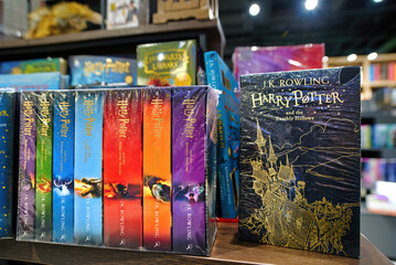 Naklejka premium Minsk, Belarus. Jan 12, 2025. Bookstore shelf with arranged Harry Potter novels in english editions written by J.K. Rowling, fantasy literature collection, magical adventure series. Selective focus