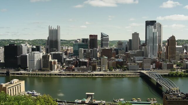 Wide shot of Pittsburgh's skyscrapers from the overlook, during a summer morning with clear skies.