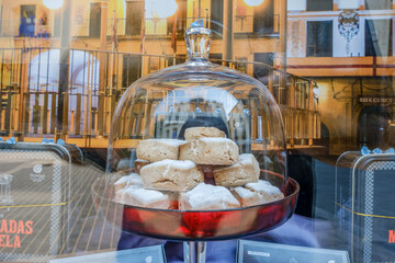 Storefront display of Mantecadas de Tudela, a traditional pastry from Navarra, Spain, with decorative packaging and artisanal presentation