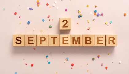 Wooden Blocks with Date 2 September. Calendar for birthday or anniversary on solid colored background with confetti