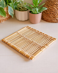 Bamboo Placemat and Indoor Plants on Wooden Table