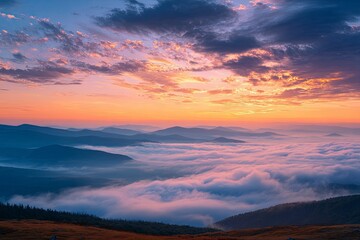 Mountain vista with dense fog blanketing valleys illuminated by a colorful sunrise