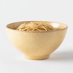 A wide, pale-yellow ceramic bowl holds a generous portion of light brown noodles against a stark white background