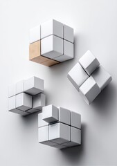 Abstract geometric shapes, interlocking white cubes, one tan cube