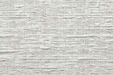 Close-up view of a textured, light beige linen fabric