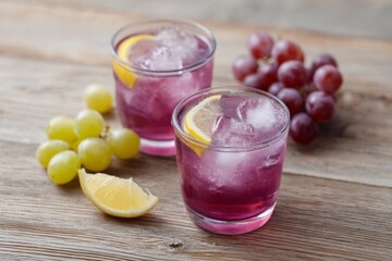 Purple grape elixirs with lemon wedges, whispered autumn equinox rituals, tantalizing harvest sips, Dionysian revelry, refreshing serenity