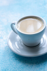  Large White Cup of Milky Coffee on a Blue Background