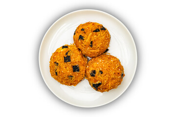 Top view of shredded chicken cakes or chicken floss cakes in white ceramic dish isolated on white background with clipping path.