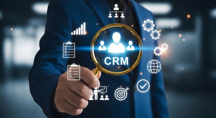 A man in a suit holds a magnifying glass over the letters CRM, surrounded by icons representing data, organization, and business processes.