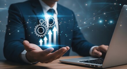 Businessman in suit using laptop with digital display of gears and upward trending arrows symbolizing growth and progress.