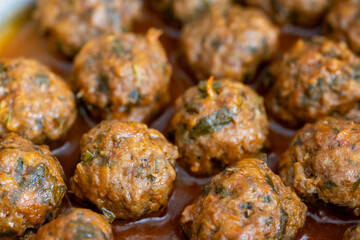 Close-Up of Spanish Albóndigas in Tomato Sauce Cooked in a Skillet
