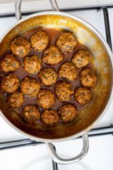 Close-Up of Spanish Albóndigas in Tomato Sauce Cooked in a Skillet
