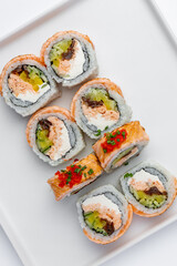 Sushi roll with salmon and caviar close up macro isolated