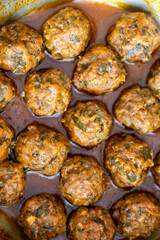 Close-Up of Spanish Albóndigas in Tomato Sauce Cooked in a Skillet
