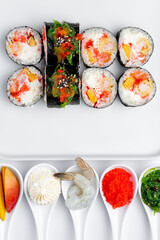Shrimp sushi roll with ingredients on a white background isolated