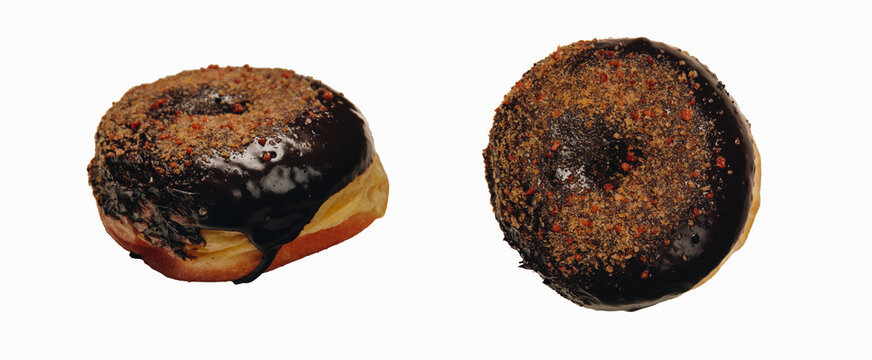 Chocolate tiramisu flavored doughnut with sprinkles on top, isolated by white background.