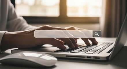 Hands typing on laptop keyboard with search bar overlay for online research and data analysis concepts