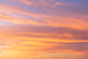 Dramatic sunset sky with twilight colors and clouds creating a beautiful nature background for design and photography use