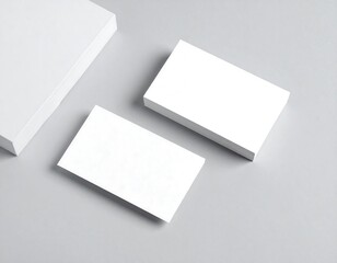 Blank business cards on a gray surface