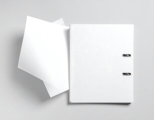Blank white binder and paper on light gray background