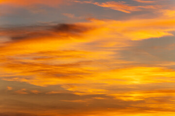 Glowing twilight sky with sunset colors and dramatic cloud background perfect for nature design elements and creative artwork