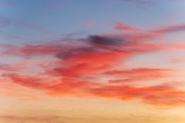 Peaceful twilight sky with colorful sunset and dramatic cloud formations creating a stunning background for natural design themes