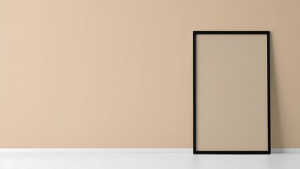Blank tall black frame leaning against a neutral peach wall