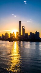 City skyline at sunrise over a river