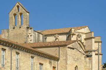 historic stone church showcasing Gothic architectural elements. Above a pointed arch or foliate...
