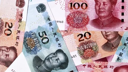 Chinese paper money, yuans in various denominations. China money as a business background for your design - Powered by Adobe