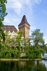 Naklejka premium Vajdahunyad Castle tower by the lake in Budapest