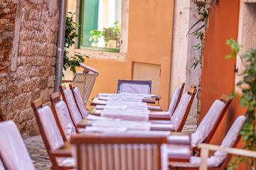 Cafe tables on narrow European streets