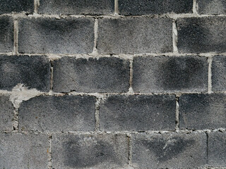 Gray concrete block wall texture with white mortar joints - Industrial construction material background for architecture and building design