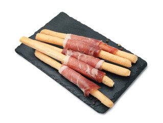 Delicious grissini sticks with prosciutto isolated on white