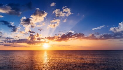 Obraz premium Beautiful Sunset Above The Sea With Clouds And Sun Twilight Sky Background