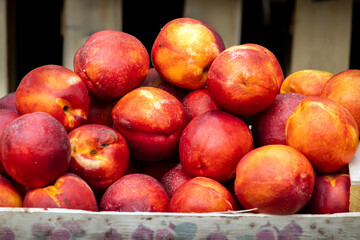 fresh peaches in wooden crate