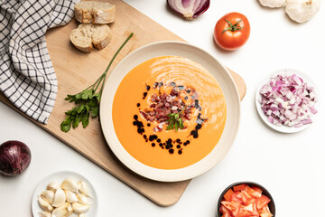 Top view of cold tomato soup, salmorejo, served with iberico jam.