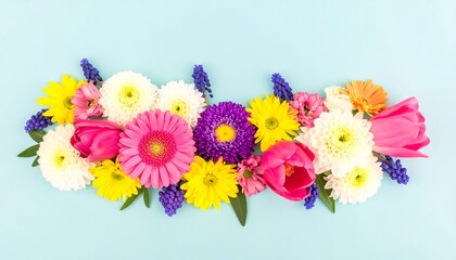 Vibrant flower arrangement on a pastel blue background